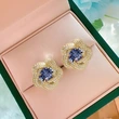  European and American imitation Tanzanite blue earrings egg-shaped temperament celebrity round face flower earrings retro style earrings