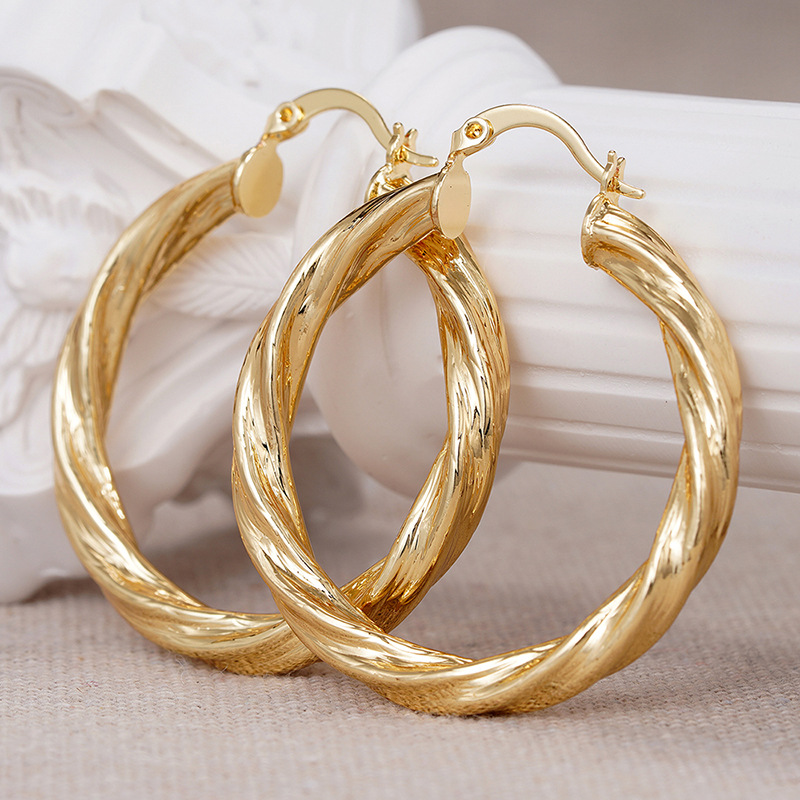 Pinxixi's new hot-selling earrings for women, spiral metal electroplating accessories, Middle Eastern, European and American Maillard earrings