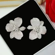 Glossy luxury floral earrings for women with micro-diamond lily flower jewelry, exaggerated dress fashionable accessories