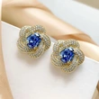  European and American imitation Tanzanite blue earrings egg-shaped temperament celebrity round face flower earrings retro style earrings