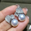   New exquisite leaf earrings imitation pearl magazine style temperament accessories fashion design earrings
