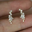 Japanese and Korean style earrings copper-plated gold-plated shining arc star-shaped zircon earrings small fresh and versatile women's earrings