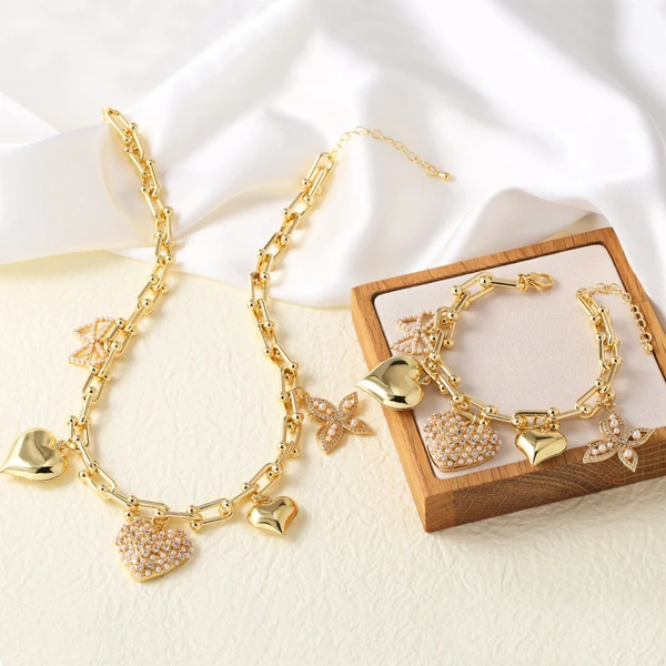 Clearance jewelry Europe and the United States hot selling love pearl butterfly pendant gold-plated necklace bracelet set female nka042