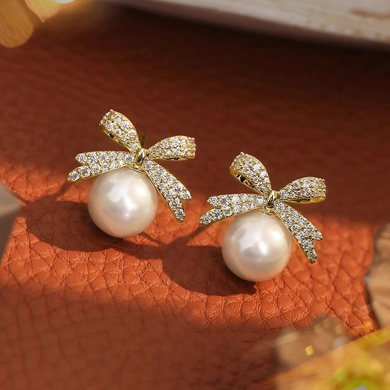  Japanese and Korean bow earrings for women, elegant and sweet accessories, imitation pearl design, hot sale