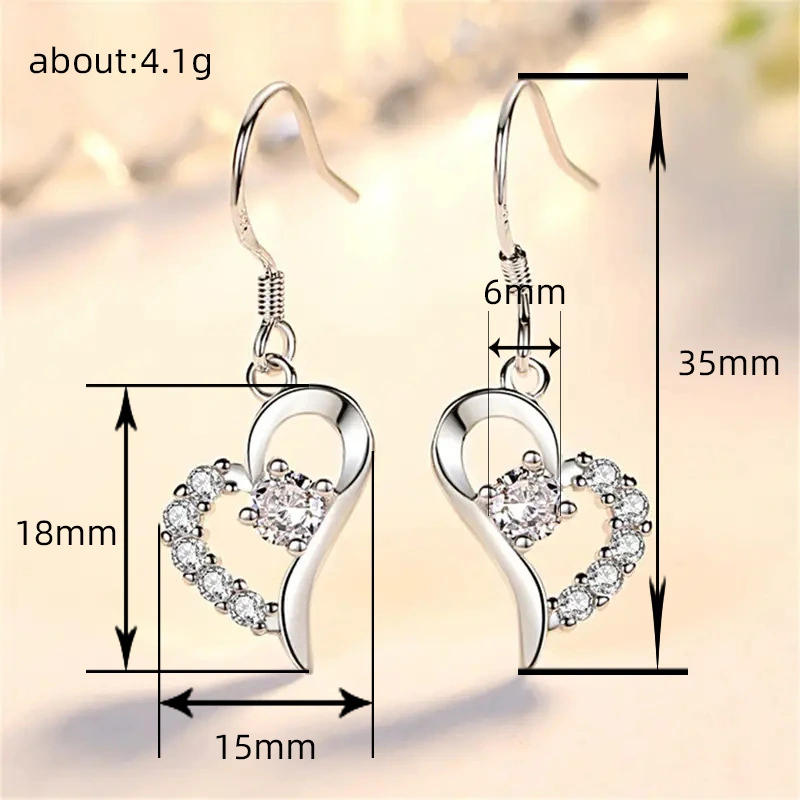  2024 new style trendy heart earrings Korean temperament long style net red earrings round face slimming earrings
