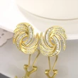  Metal micro-inlaid design earrings for women, personalized niche zircon jewelry, vortex eye-catching light luxury style jewelry