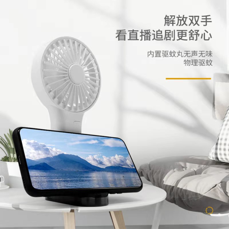 Hand held mosquito repellent fan