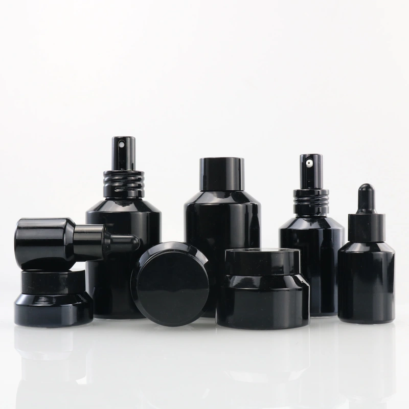 hot sale cosmetic glass bottle and jar with black frosted amber color and pump spray dropper for essential oil serum packaging