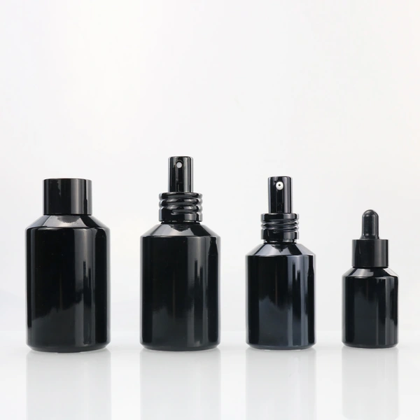 hot sale cosmetic glass bottle and jar with black frosted amber color and pump spray dropper for essential oil serum packaging
