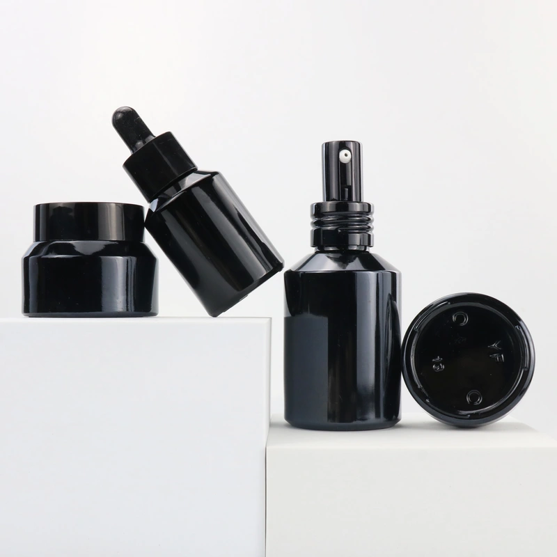 hot sale cosmetic glass bottle and jar with black frosted amber color and pump spray dropper for essential oil serum packaging