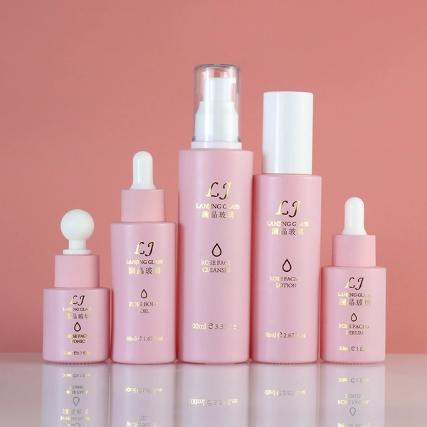 pink cosmetic round perfume glass  pump spray  bottle and cream jar