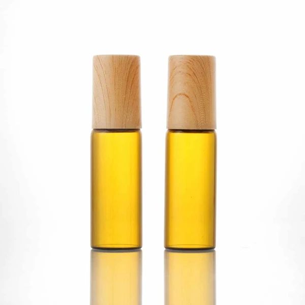 pink 5ml empty glass perfume roll on bottles with plastic bamboo cap