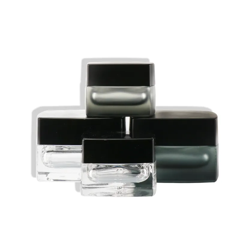 empty square clear cosmetic face lotion cream glass bottle jar
