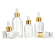 transparent square glass serum hair oil bottle with gold dropper