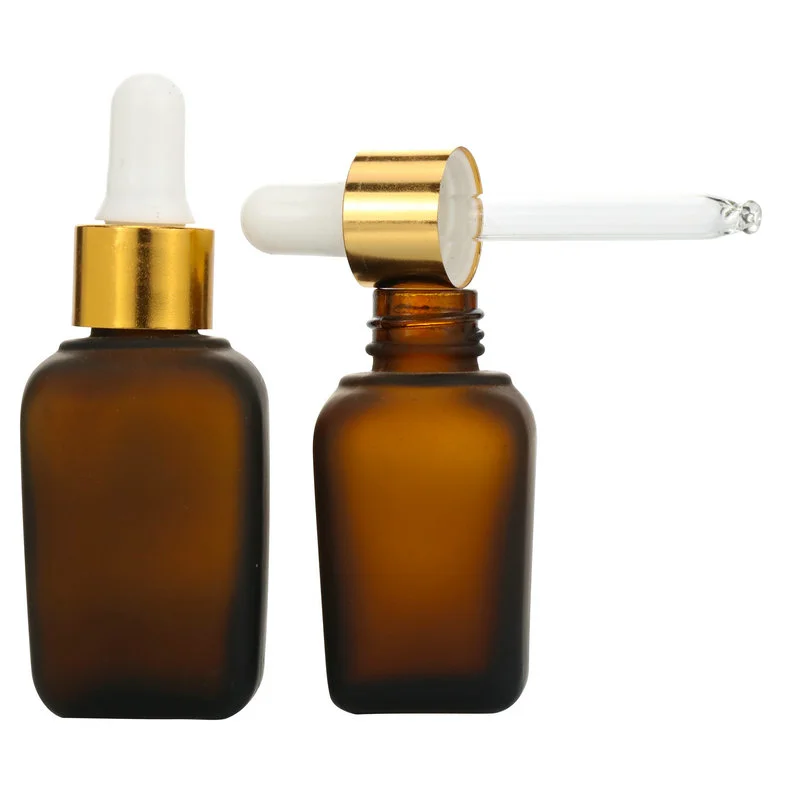 transparent square glass serum hair oil bottle with gold dropper