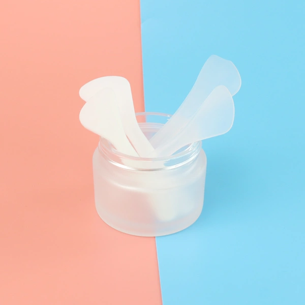 empty face cream jar container packaging with spoon