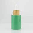 White essential oil serum glass dropper bottle with bamboo cap