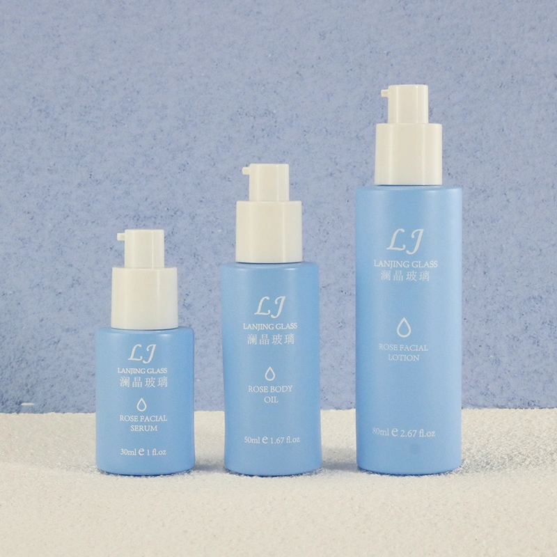 Cleaning products refillable container empty blue glass spray bottle