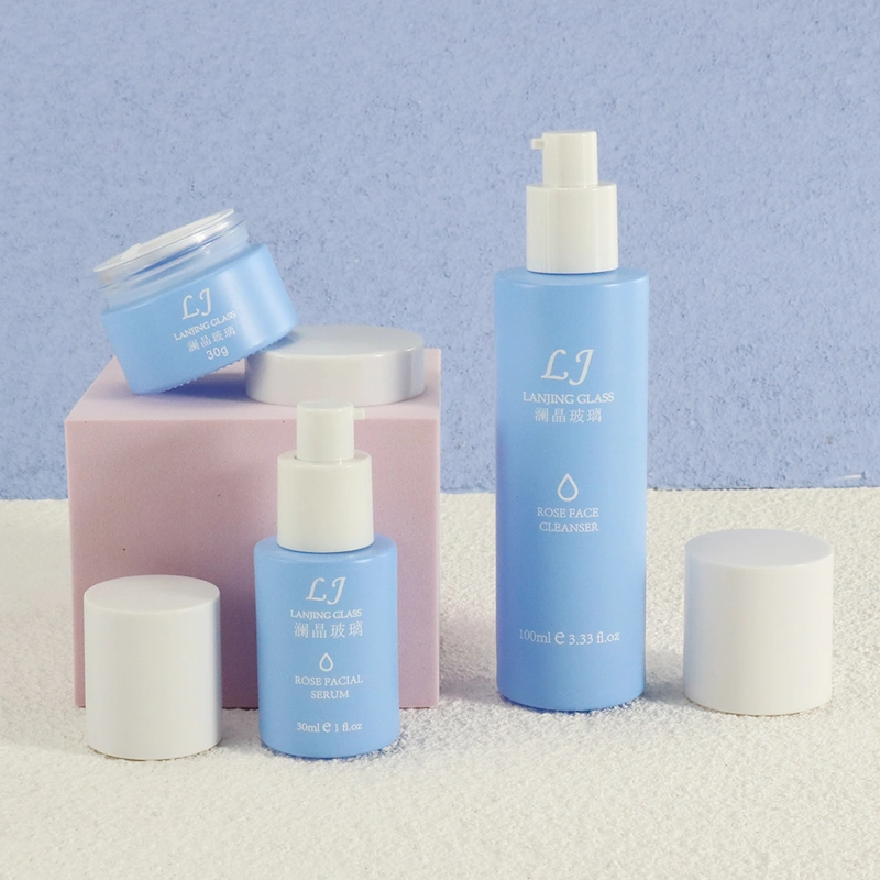 Cleaning products refillable container empty blue glass spray bottle