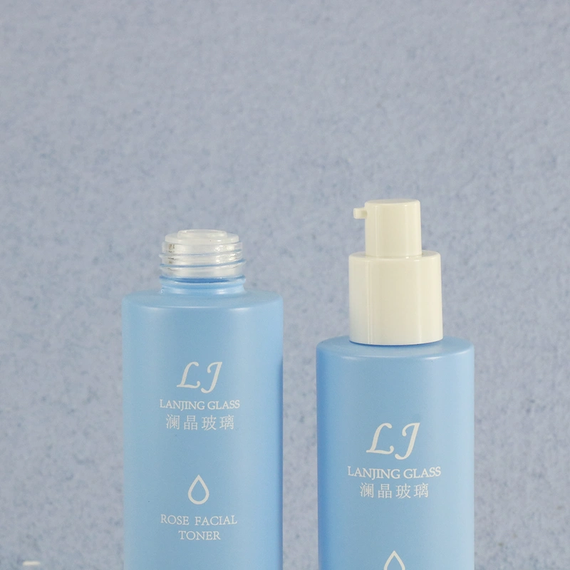 Cleaning products refillable container empty blue glass spray bottle