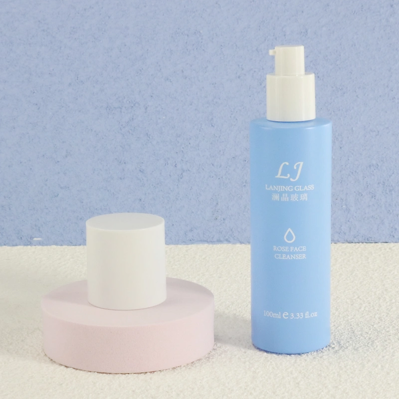 Cleaning products refillable container empty blue glass spray bottle