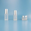 matte glass spray bottle with silver cap