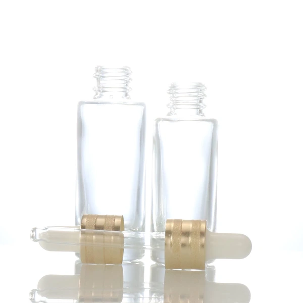 oil dropper bottle  transparent glass bottle  gold lid glass bottle