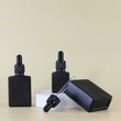 bottle black cosmetic essential  perfume bottle 