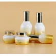body cream jar; frosted spray bottle; luxury skincare bottle set