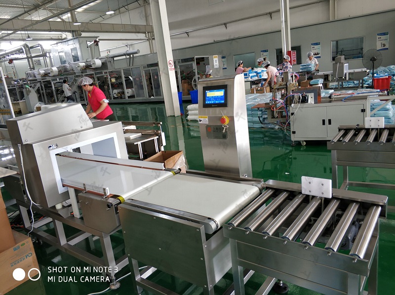 online weight checking and metal detection