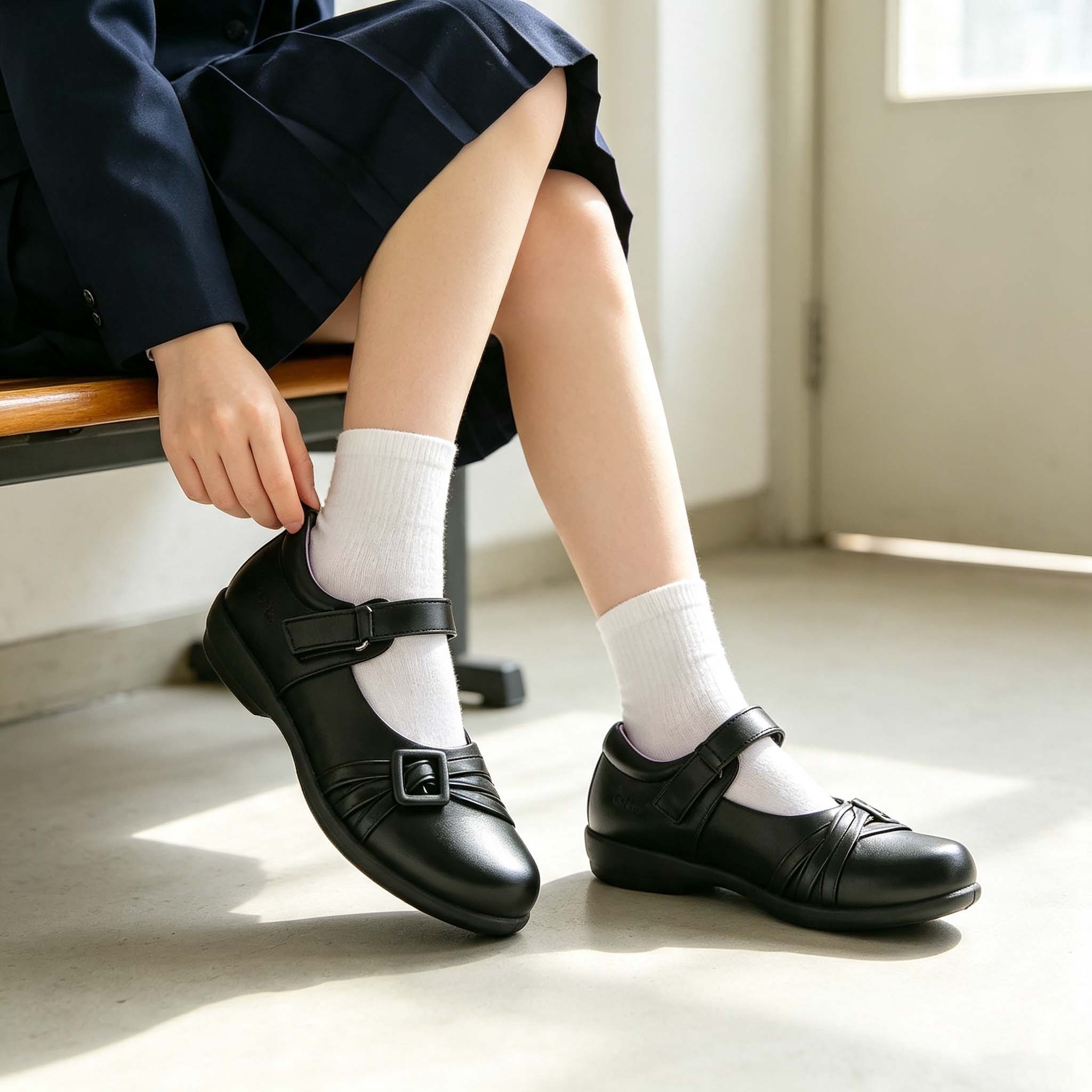 child walking indoor wearing black girls mary jane school shoes