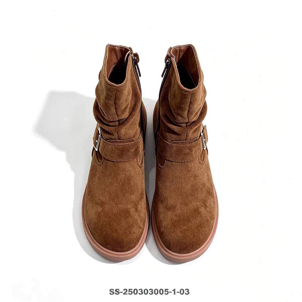 Top down view of a pair brown faux suede slouch girls boots
