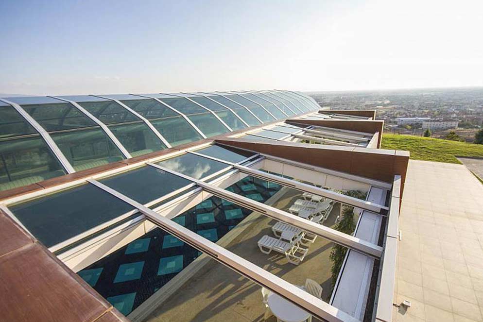 What are the advantages of using a remote-controlled sliding glass roof?