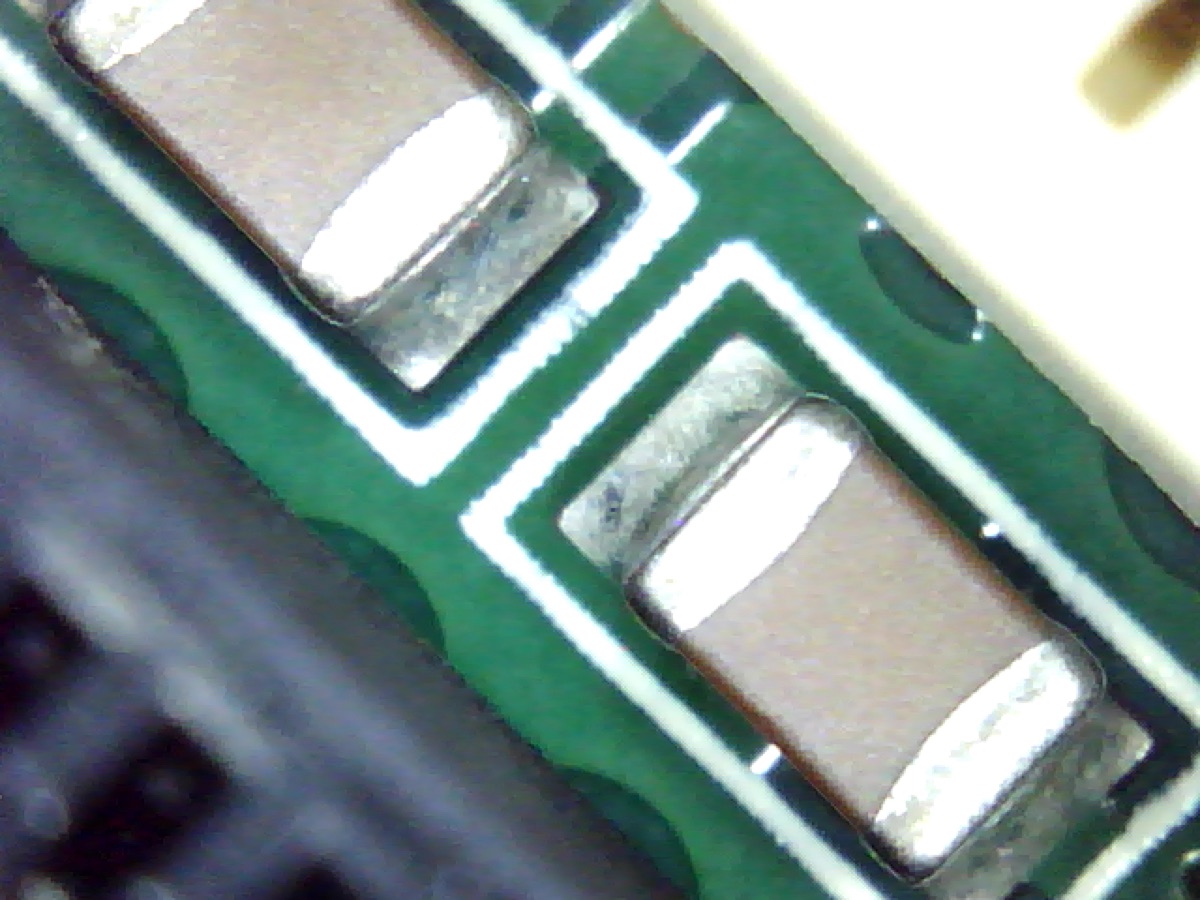 Same PCBA after aqueous cleaning, flux residue removed