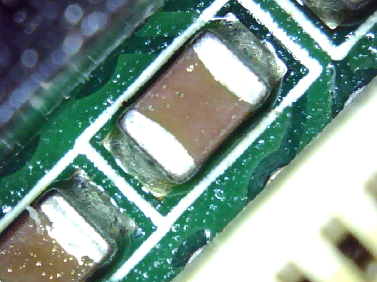 PCBA with visible flux residue after wave soldering, before cleaning