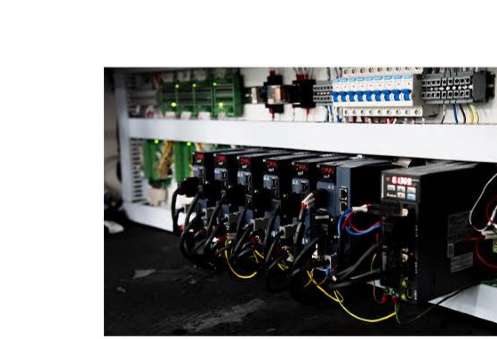 Row of tape feeders mounted on the S3010A sequencer with cable looms