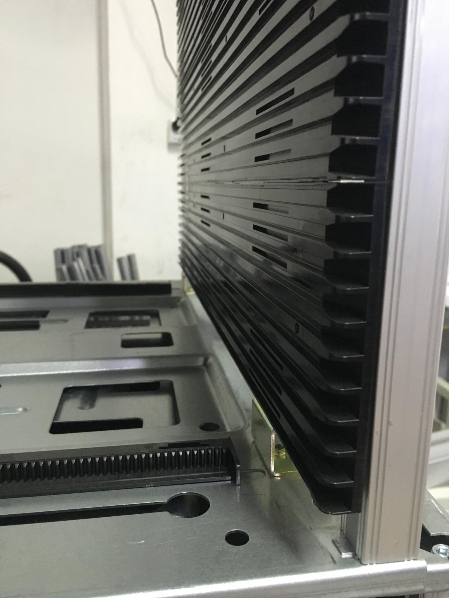 Close-up of the antistatic magazine slots holding long PCBs