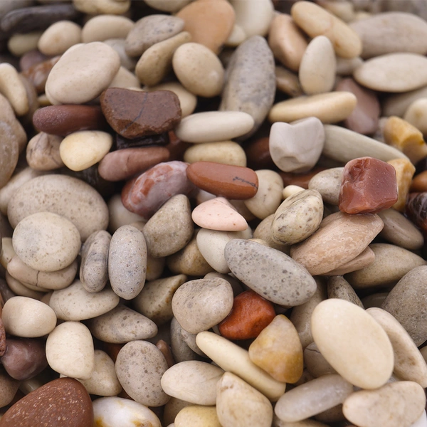 Fish tank landscaping with sand bottom and natural stream stones
