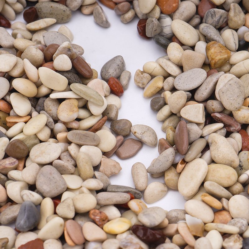 Fish tank landscaping with sand bottom and natural stream stones